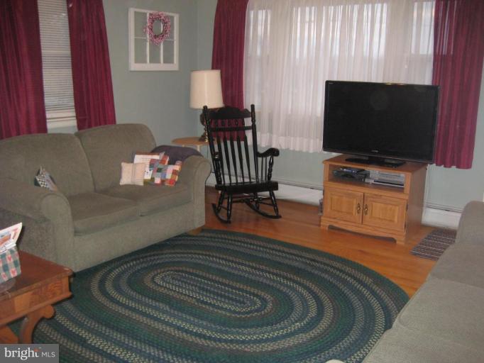 4616 Maple Grove Road Hampstead, MD 21074 - Photo 11 of 15 a living room with furniture and a flat screen tv