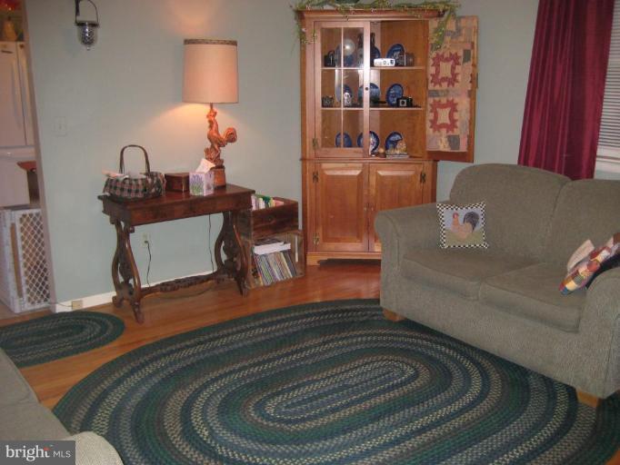 4616 Maple Grove Road Hampstead, MD 21074 - Photo 12 of 15 a living room with furniture and wooden floor