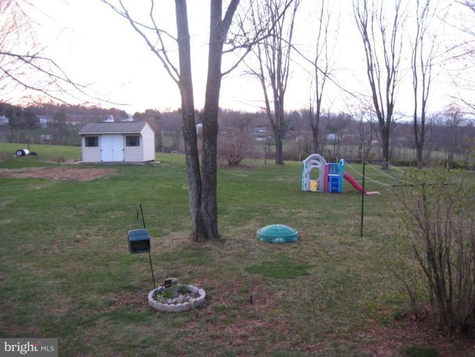 4616 Maple Grove Road Hampstead, MD 21074 - Photo 15 of 15 a view of a chairs in a backyard