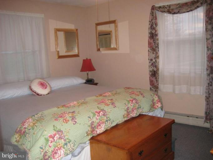 4616 Maple Grove Road Hampstead, MD 21074 - Photo 5 of 15 a bedroom with a bed and a window