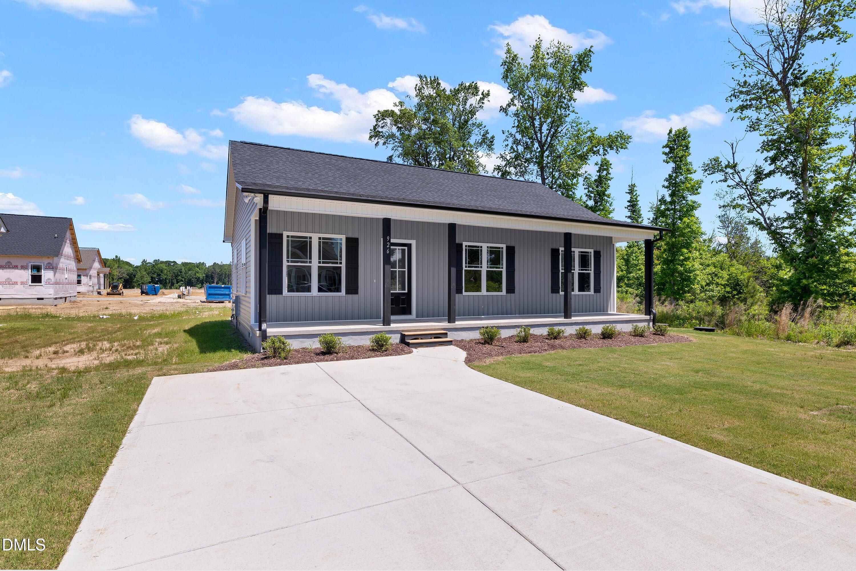 926 Micro Road West Selma, NC 27576 - Photo 5 of 41 a house with swimming pool in front of it