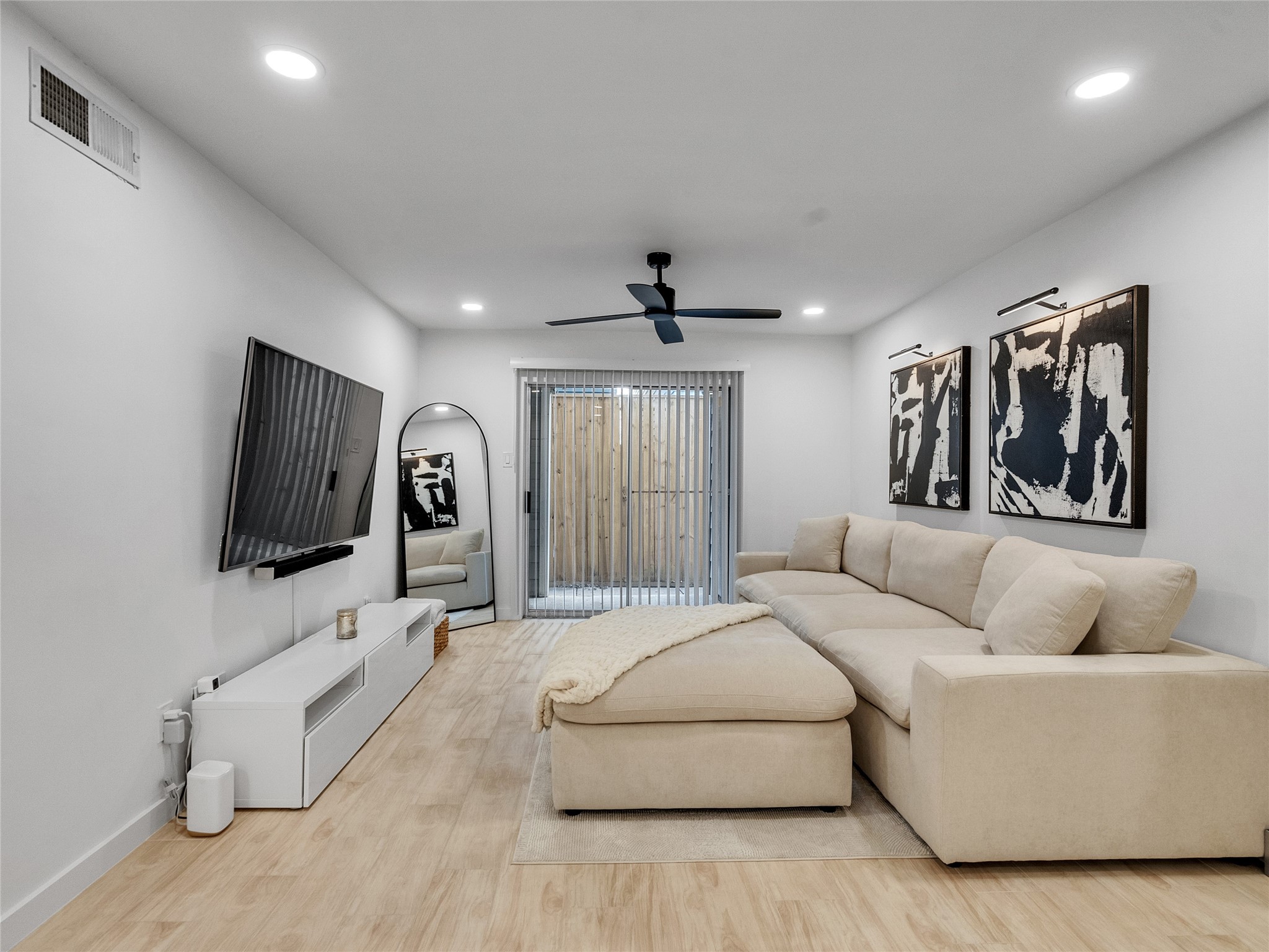 4200 Watson Street, Unit 201 Houston, TX 77009 - Photo 1 of 21 a living room with furniture and a flat screen tv
