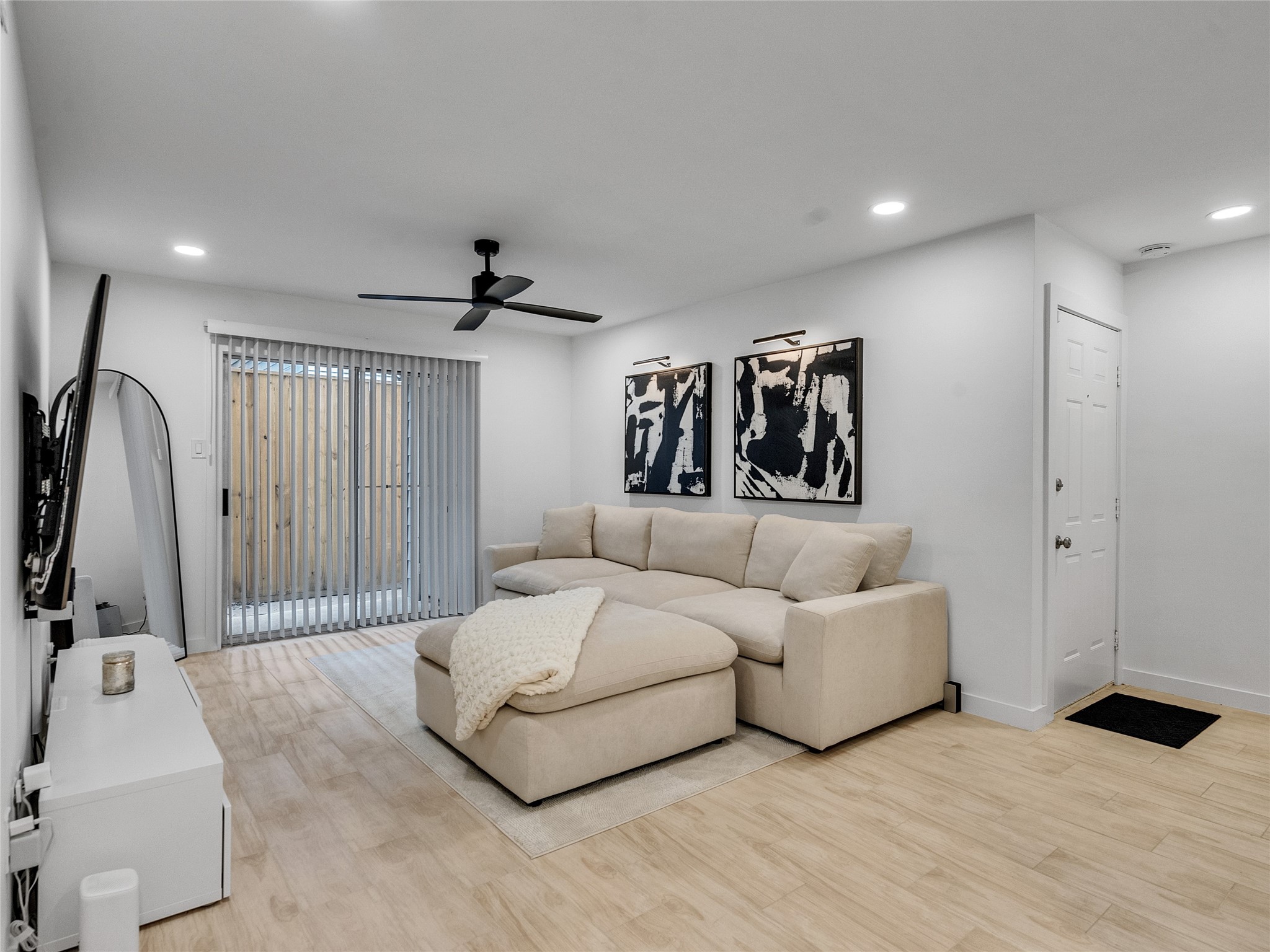 4200 Watson Street, Unit 201 Houston, TX 77009 - Photo 2 of 21 a spacious bedroom with a bed and a large mirror