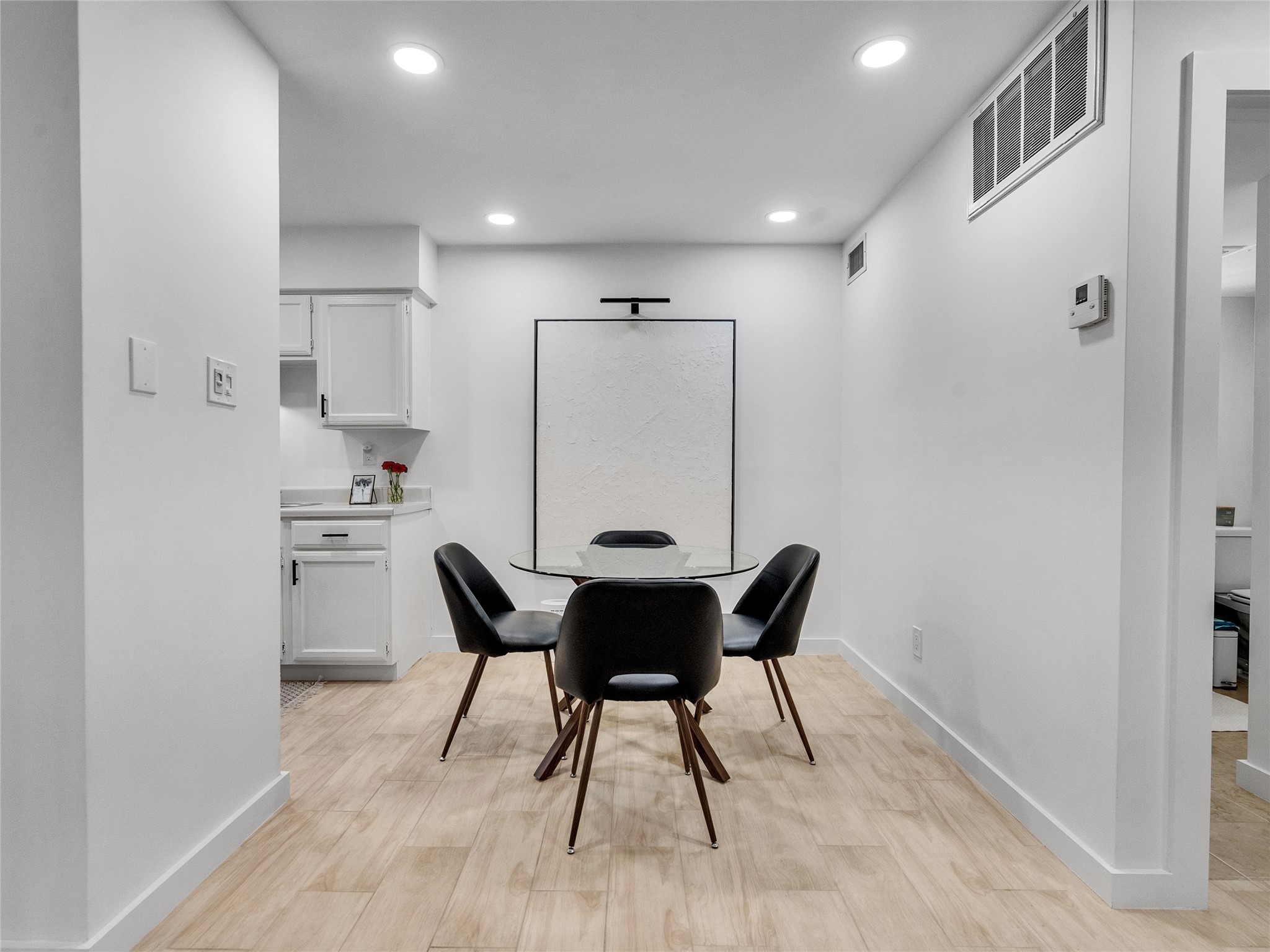 4200 Watson Street, Unit 201 Houston, TX 77009 - Photo 5 of 21 a view of a dining room with furniture and wooden floor