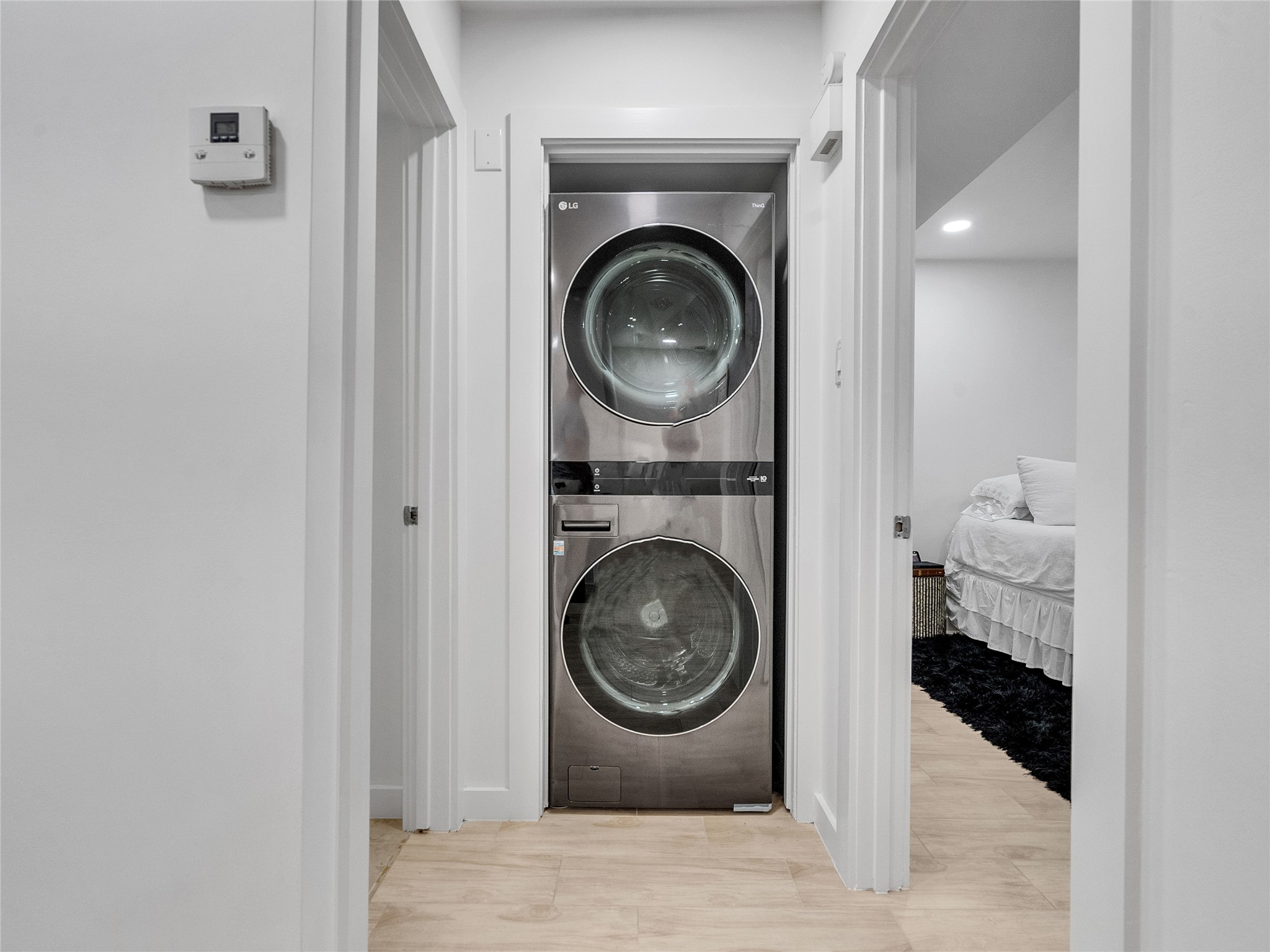 4200 Watson Street, Unit 201 Houston, TX 77009 - Photo 10 of 21 a view of a hallway with washer and dryer