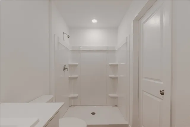 a bathroom with a shower and bathtub