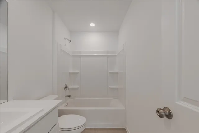 a bathroom with a bathtub toilet and sink