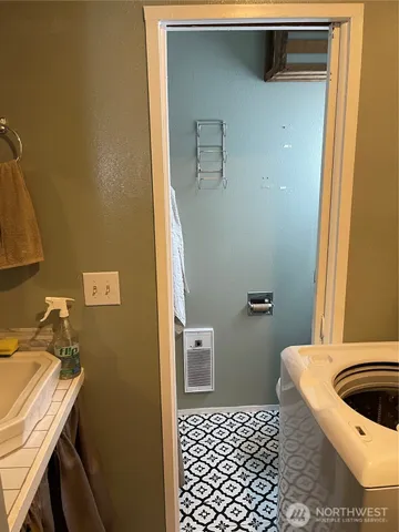 a bedroom with bed and a window