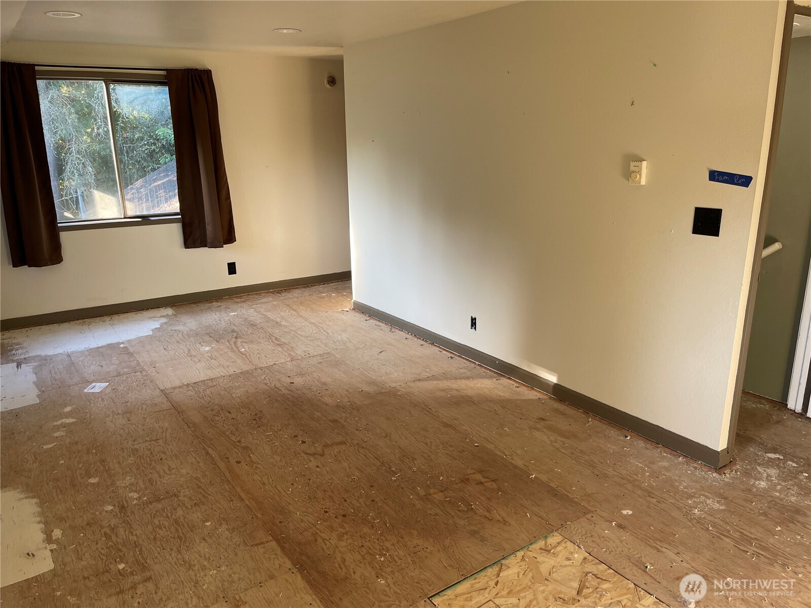 16460 Scandia Road Northwest Poulsbo, WA 98370 - Photo 22 of 33 a view of an empty room with windows
