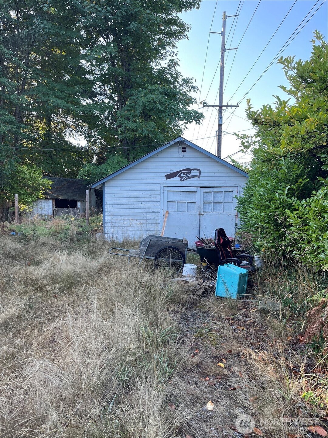 16460 Scandia Road Northwest Poulsbo, WA 98370 - Photo 26 of 33 a view of a house with a yard
