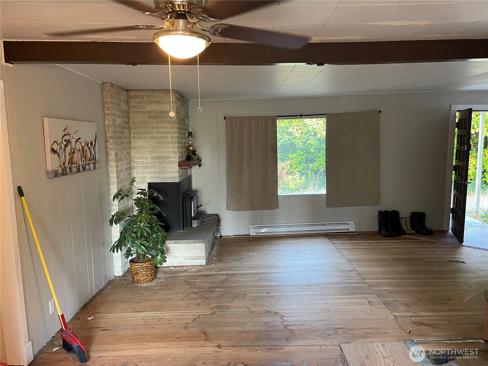 16460 Scandia Road Northwest Poulsbo, WA 98370 - Photo 7 of 33 an empty room with wooden floor and windows