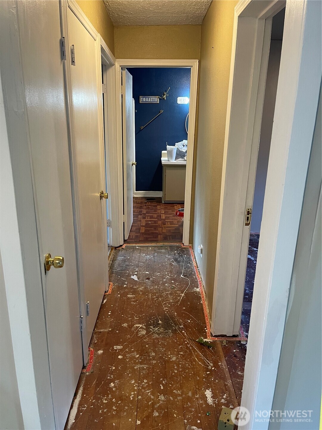 16460 Scandia Road Northwest Poulsbo, WA 98370 - Photo 8 of 33 a view of a hallway with wooden shelves