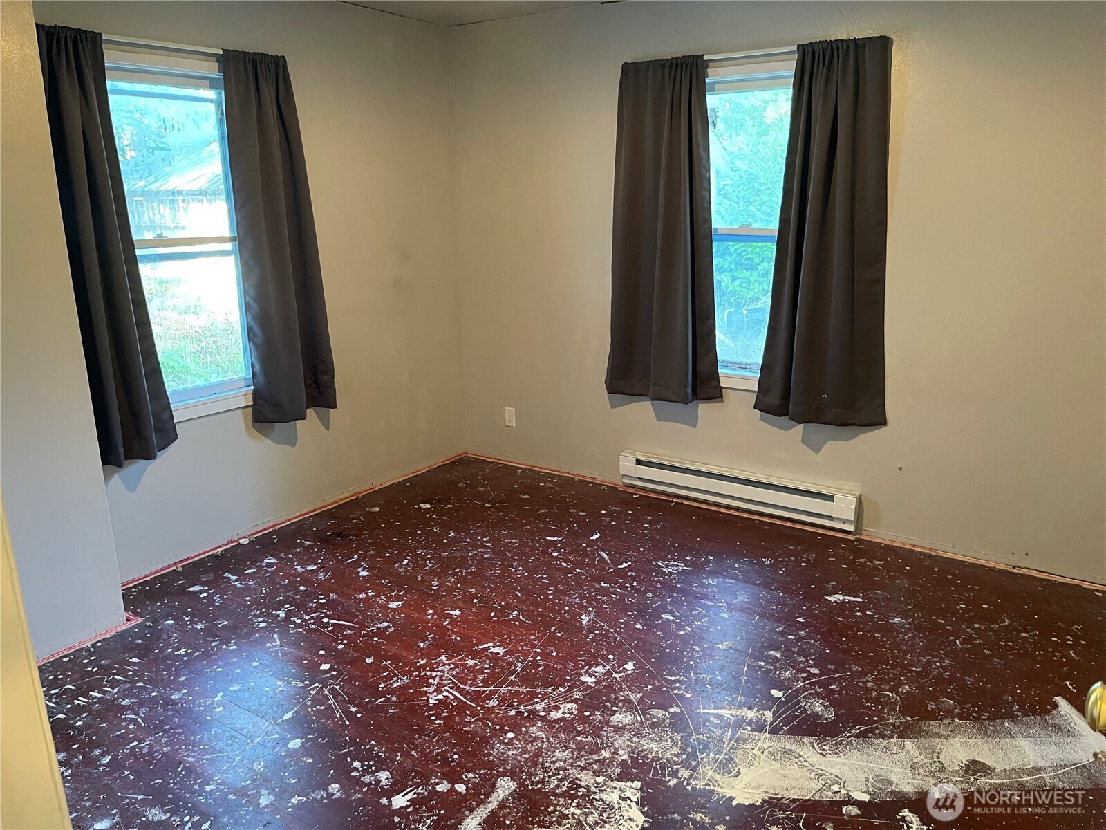 16460 Scandia Road Northwest Poulsbo, WA 98370 - Photo 9 of 33 a view of a livingroom with wooden floor and a window