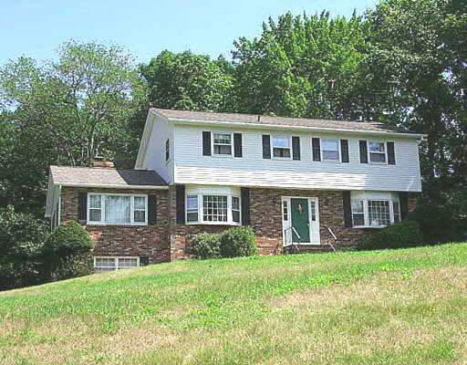31 Pond Crest Road Danbury, CT 06811 - Photo 1 of 1 a front view of a house with garden