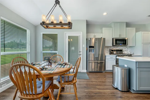a dining room with furniture and window