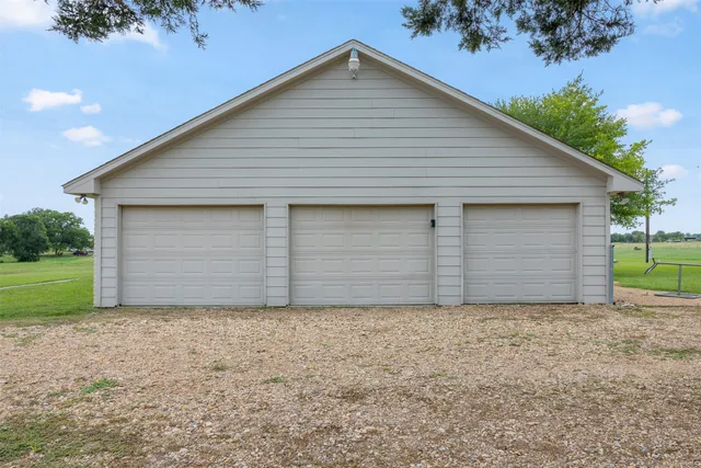 a view of a big room with cabinet and a yard