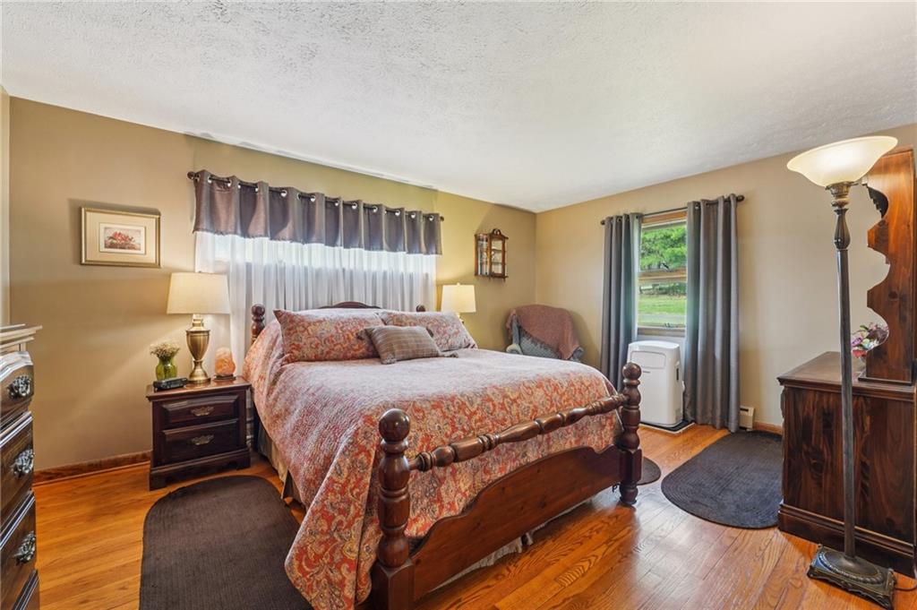 2691 Harlansburg Road New Castle, PA 16101 - Photo 13 of 42 a bed room with a bed window and a dresser