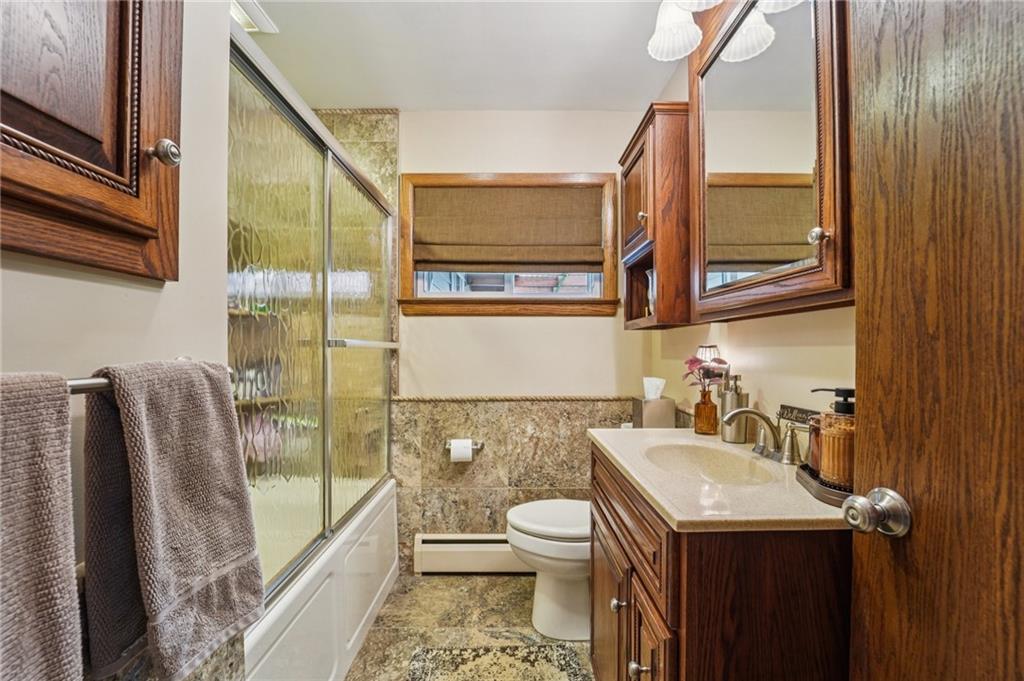 2691 Harlansburg Road New Castle, PA 16101 - Photo 15 of 42 a bathroom with a sink a toilet and shower