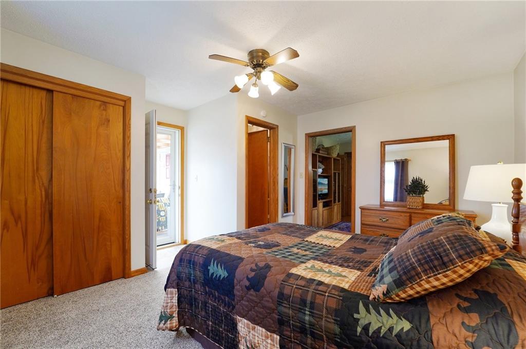 2691 Harlansburg Road New Castle, PA 16101 - Photo 19 of 42 a bedroom with a bed and a chandelier