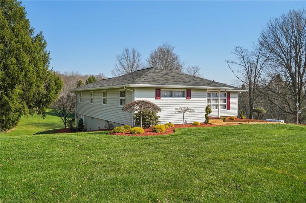 2691 Harlansburg Road New Castle, PA 16101 - Photo 2 of 42 a front view of a house with a yard and garage