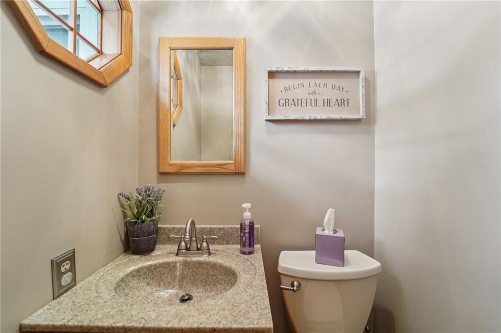 2691 Harlansburg Road New Castle, PA 16101 - Photo 22 of 42 a bathroom with a toilet sink and mirror