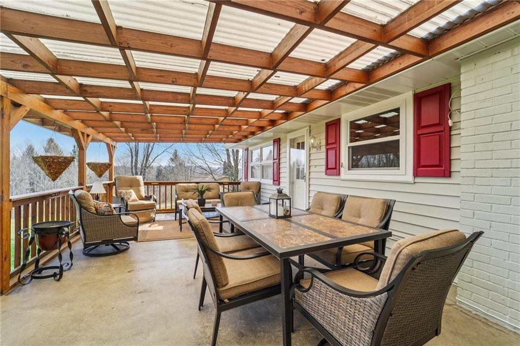 2691 Harlansburg Road New Castle, PA 16101 - Photo 24 of 42 a view of a patio with a table and chairs