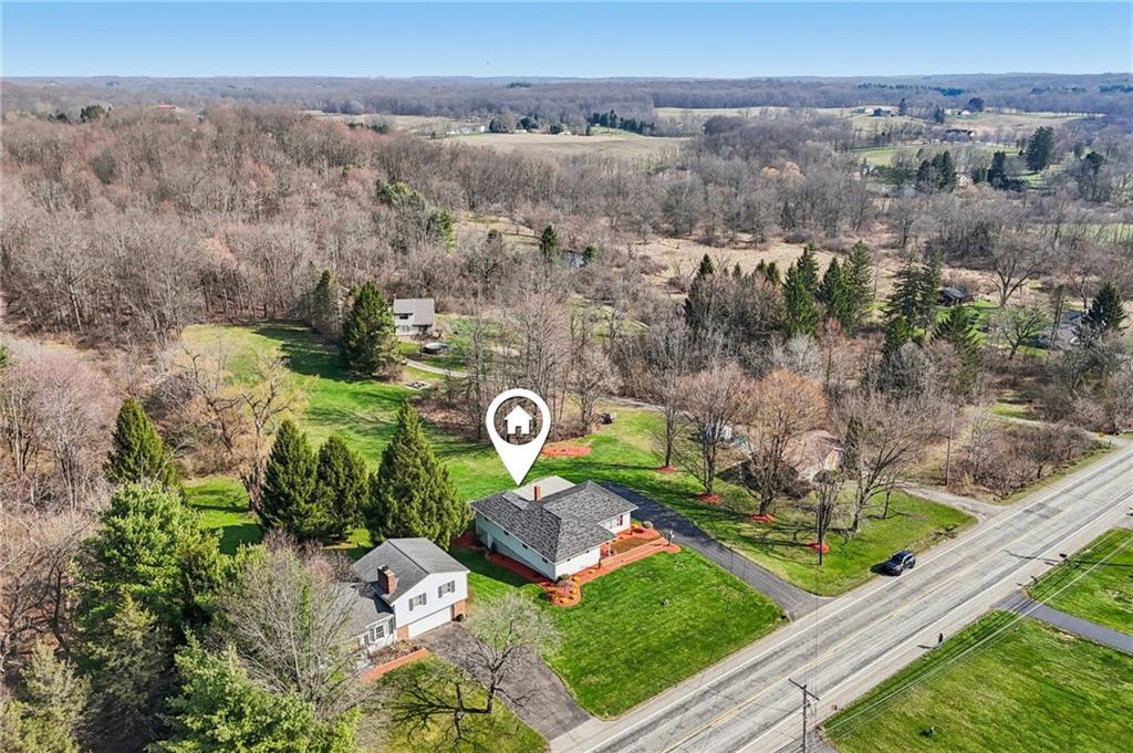 2691 Harlansburg Road New Castle, PA 16101 - Photo 39 of 42 an aerial view of a house with a garden and mountain view