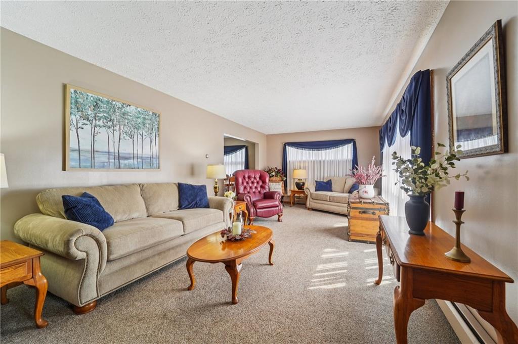 2691 Harlansburg Road New Castle, PA 16101 - Photo 7 of 42 a living room with furniture and a chandelier