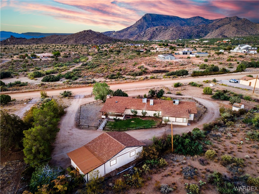 2063 East Sundown Road Kingman, AZ 86409 - Photo 1 of 40 Drone / aerial view featuring a mountain view