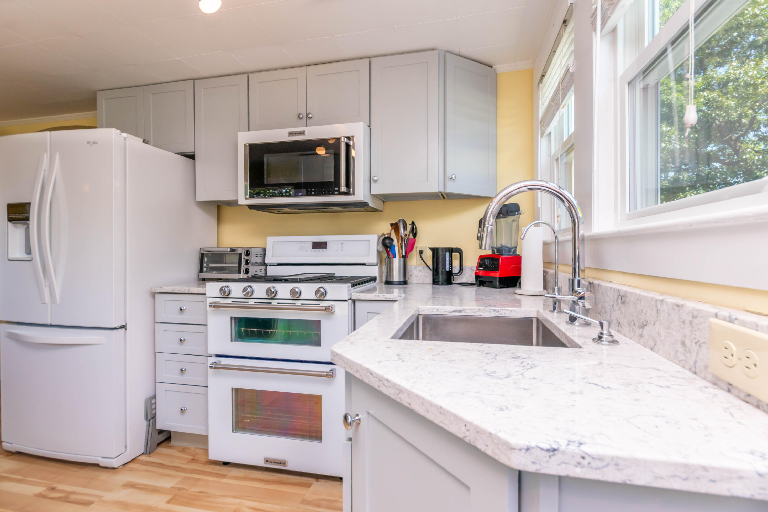 17 Ivy Street Wareham, MA 02571 - Photo 11 of 31 a kitchen with granite countertop a sink stove and refrigerator