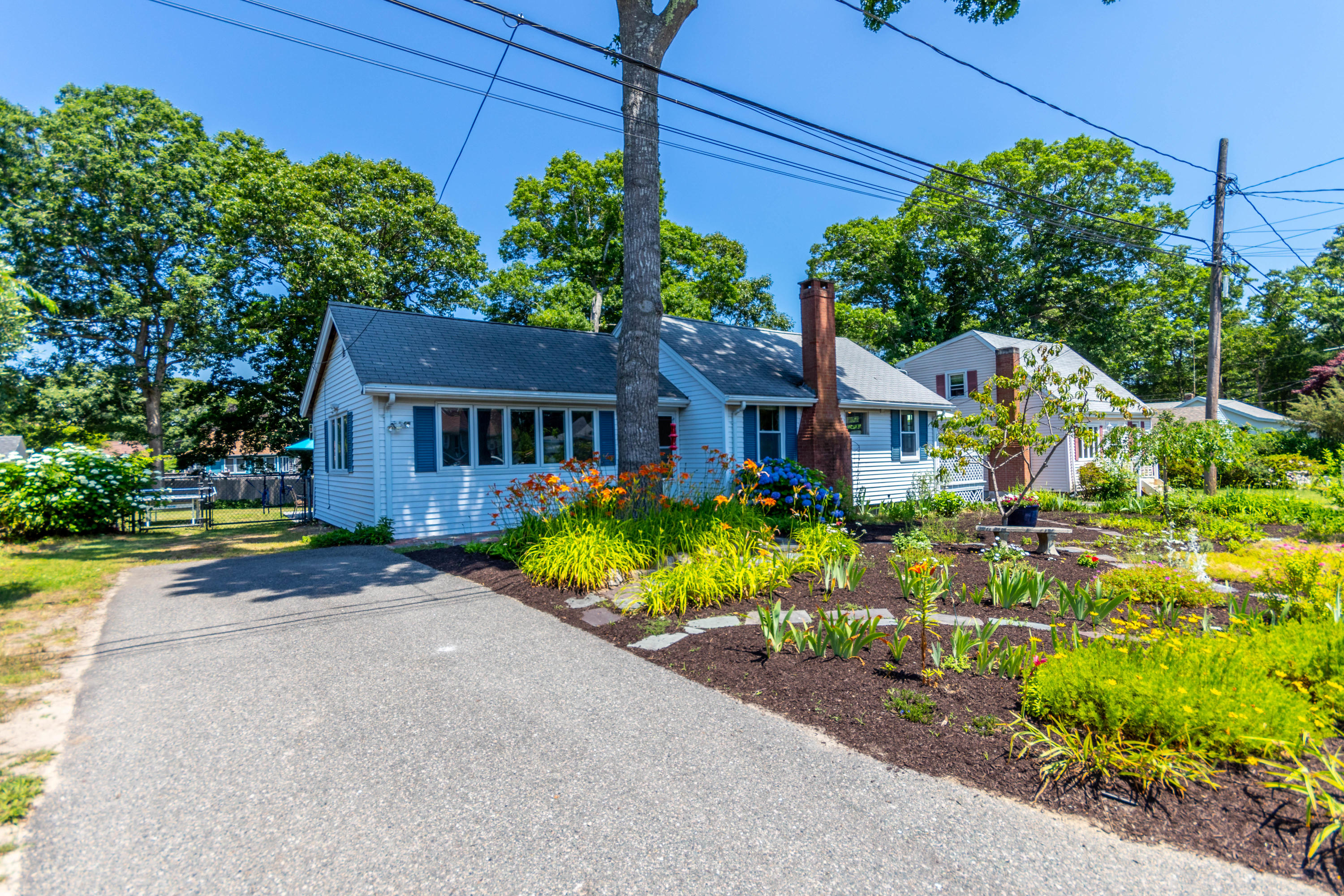 17 Ivy Street Wareham, MA 02571 - Photo 19 of 31 a front view of a house with a yard and outdoor seating