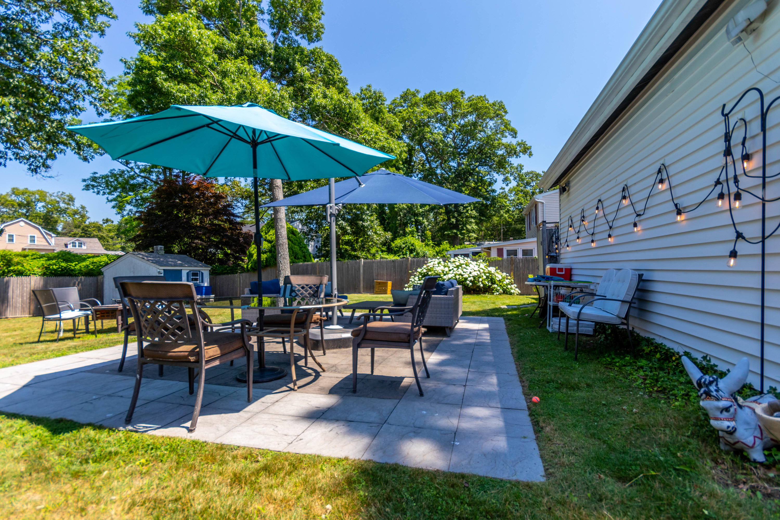 17 Ivy Street Wareham, MA 02571 - Photo 25 of 31 a view of a backyard with sitting area and a slide
