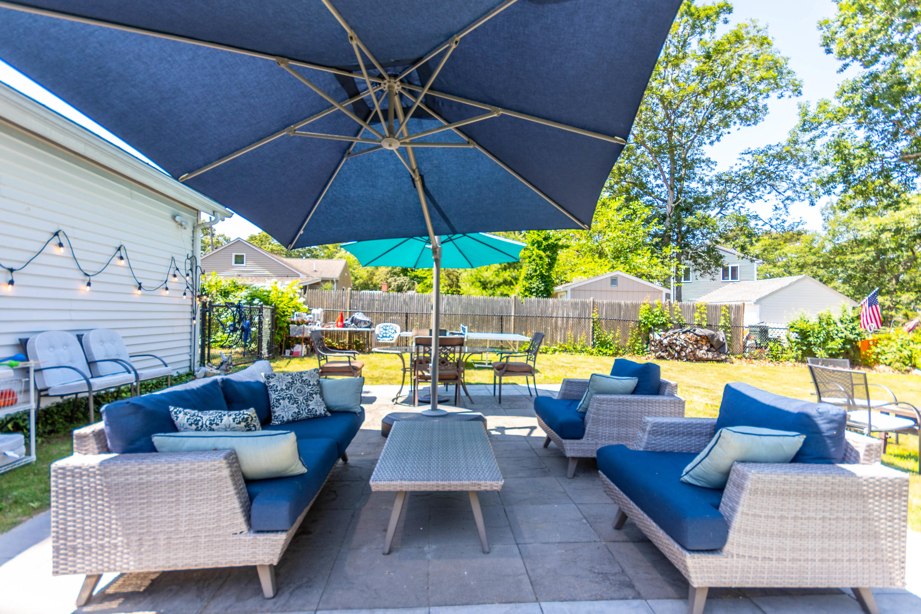 17 Ivy Street Wareham, MA 02571 - Photo 26 of 31 a view of a patio with couches and umbrella