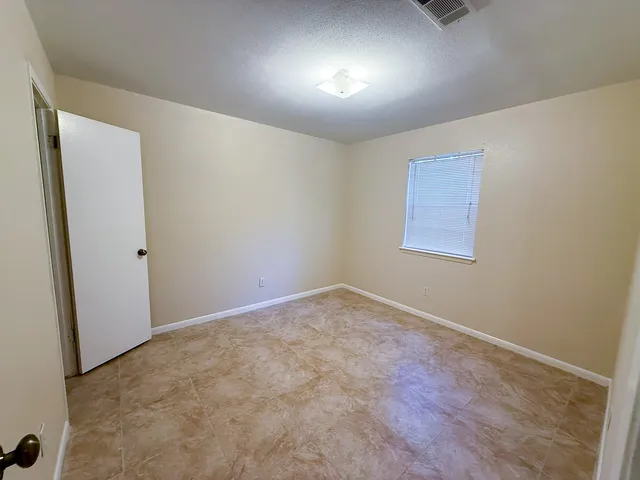 an empty room with a workbench