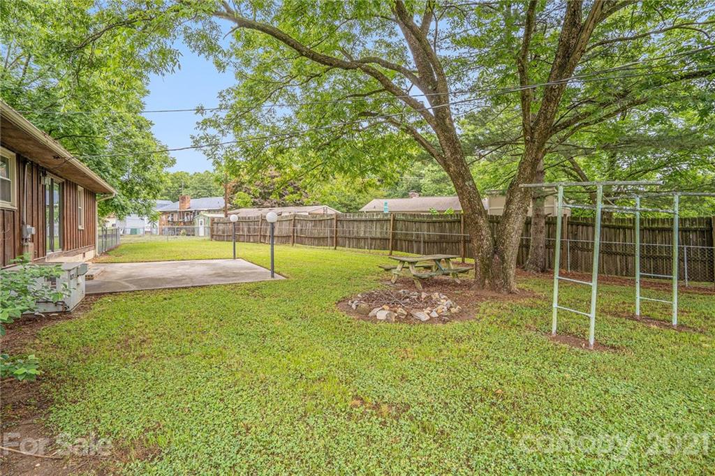 5661 Tuckaseegee Road Kannapolis, NC 28081 - Photo 13 of 18 a view of a backyard with swimming pool