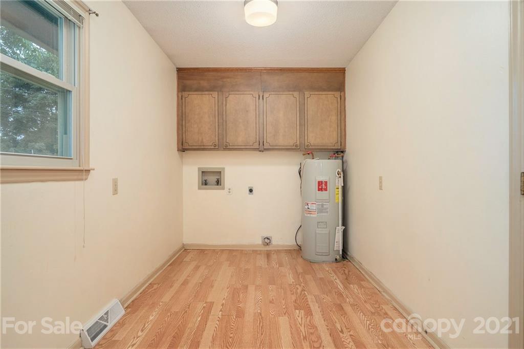 5661 Tuckaseegee Road Kannapolis, NC 28081 - Photo 18 of 18 a view of a storage & utility room with a sink