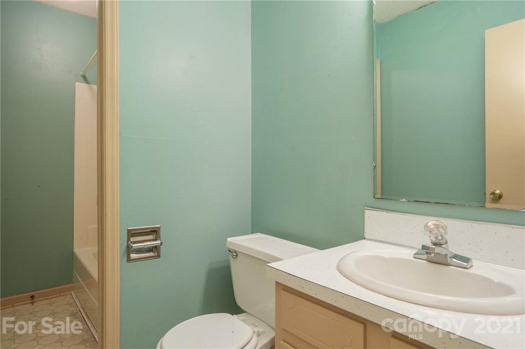 5661 Tuckaseegee Road Kannapolis, NC 28081 - Photo 4 of 18 a bathroom with a sink and a toilet
