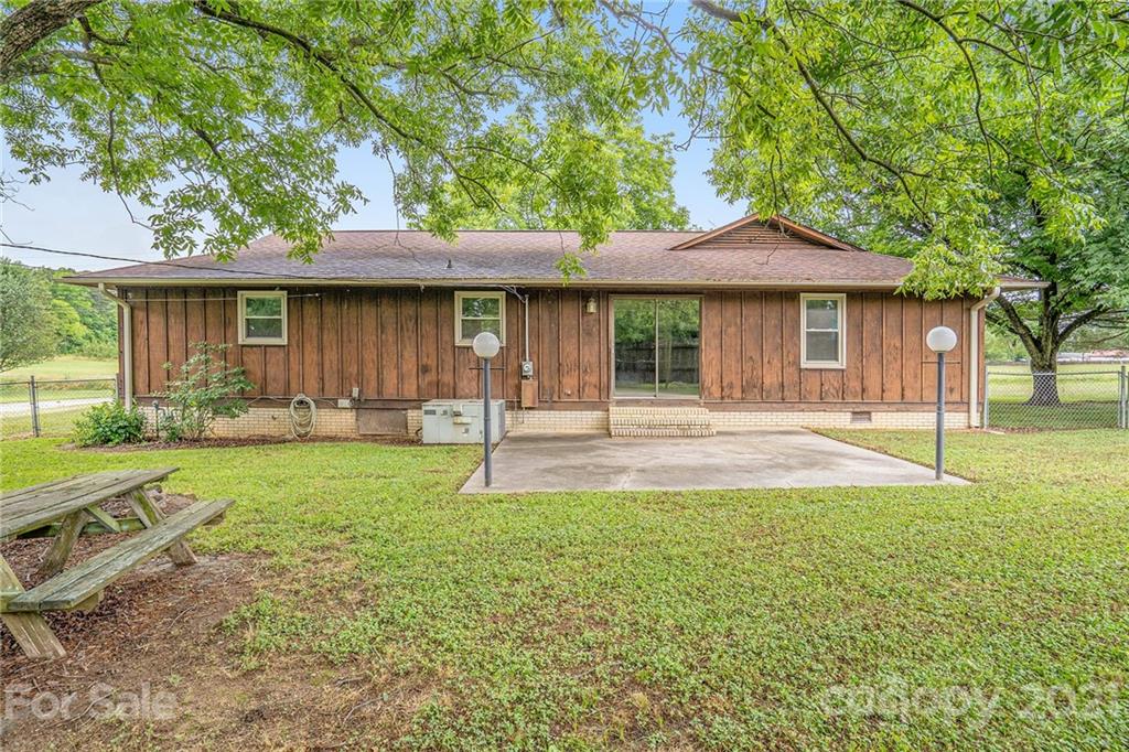 5661 Tuckaseegee Road Kannapolis, NC 28081 - Photo 5 of 18 a front view of a house with a yard
