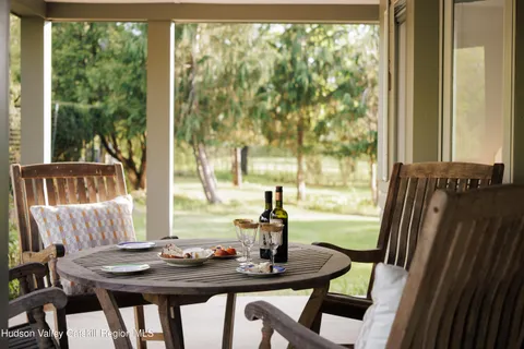 a view of a dining room with furniture window and outside view