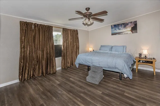 a view of a livingroom with furniture and wooden floor
