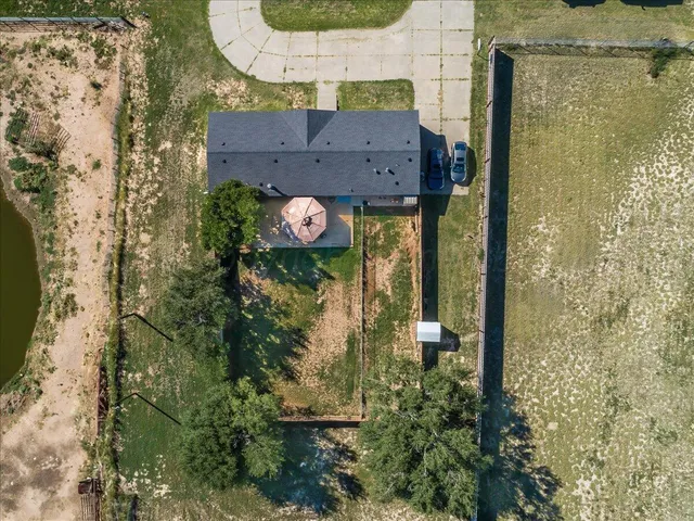 an aerial view of residential house with outdoor space and parking
