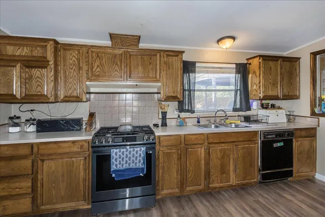 a kitchen with a stove and cabinets