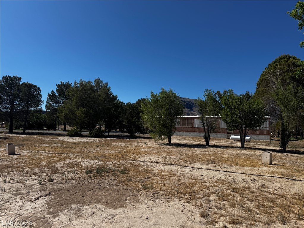 3090 Gally Road Pahrump, NV 89060 - Photo 7 of 20 A spacious desert lot offers endless possibilities for your dream estate, backed by scenic mountains.