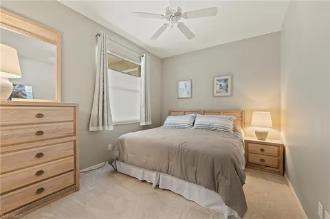 a bedroom with a bed and a mirror