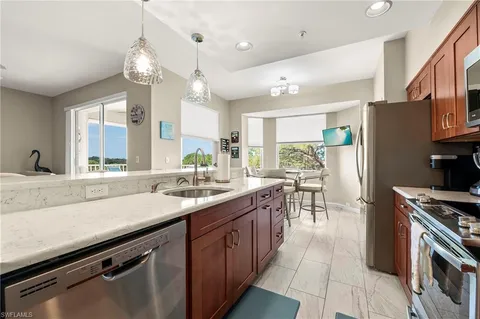 a kitchen with counter top space cabinets and stainless steel appliances