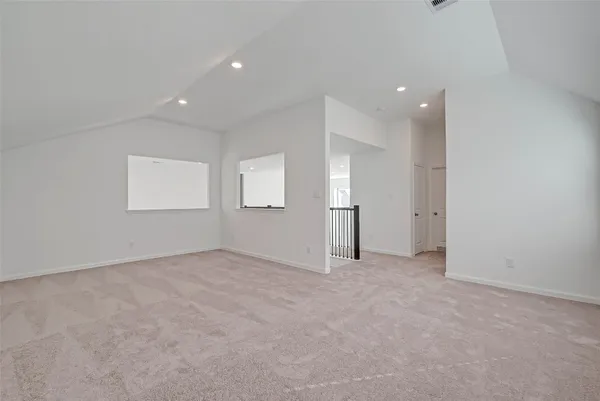 a view of a hallway with windows