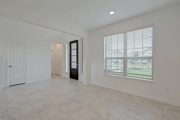 a view of an entryway with an empty room