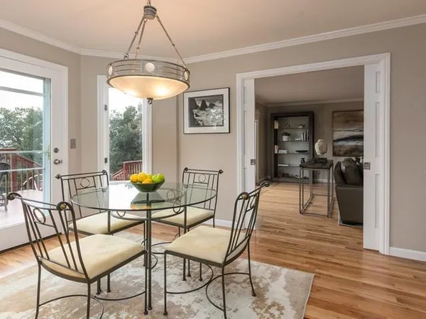 a dining room with furniture and window