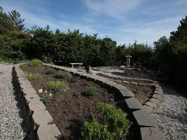 a view of a garden with houses