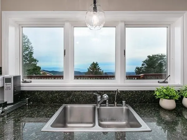 a kitchen with a sink and a window